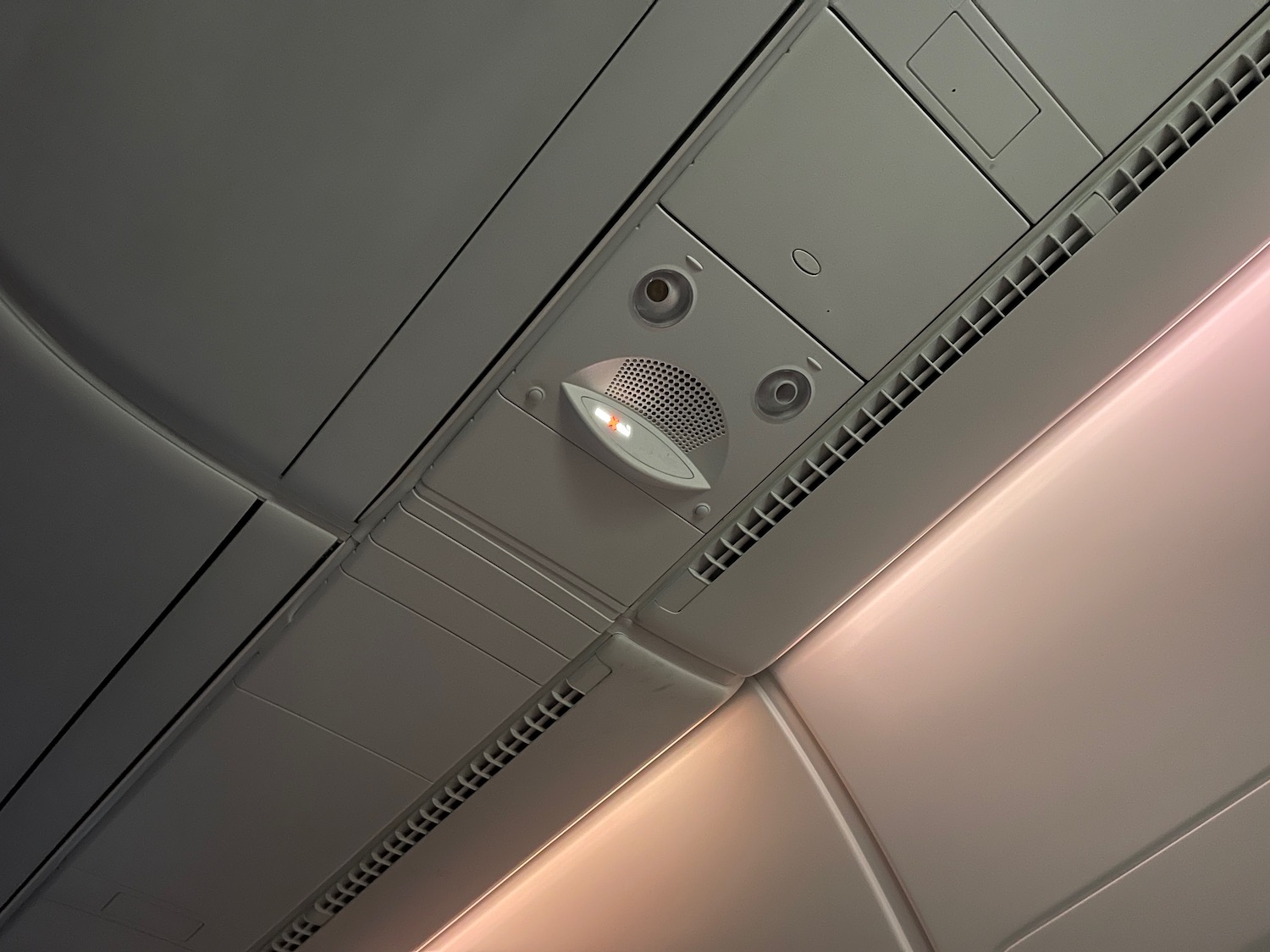 a ceiling with a light and air conditioning