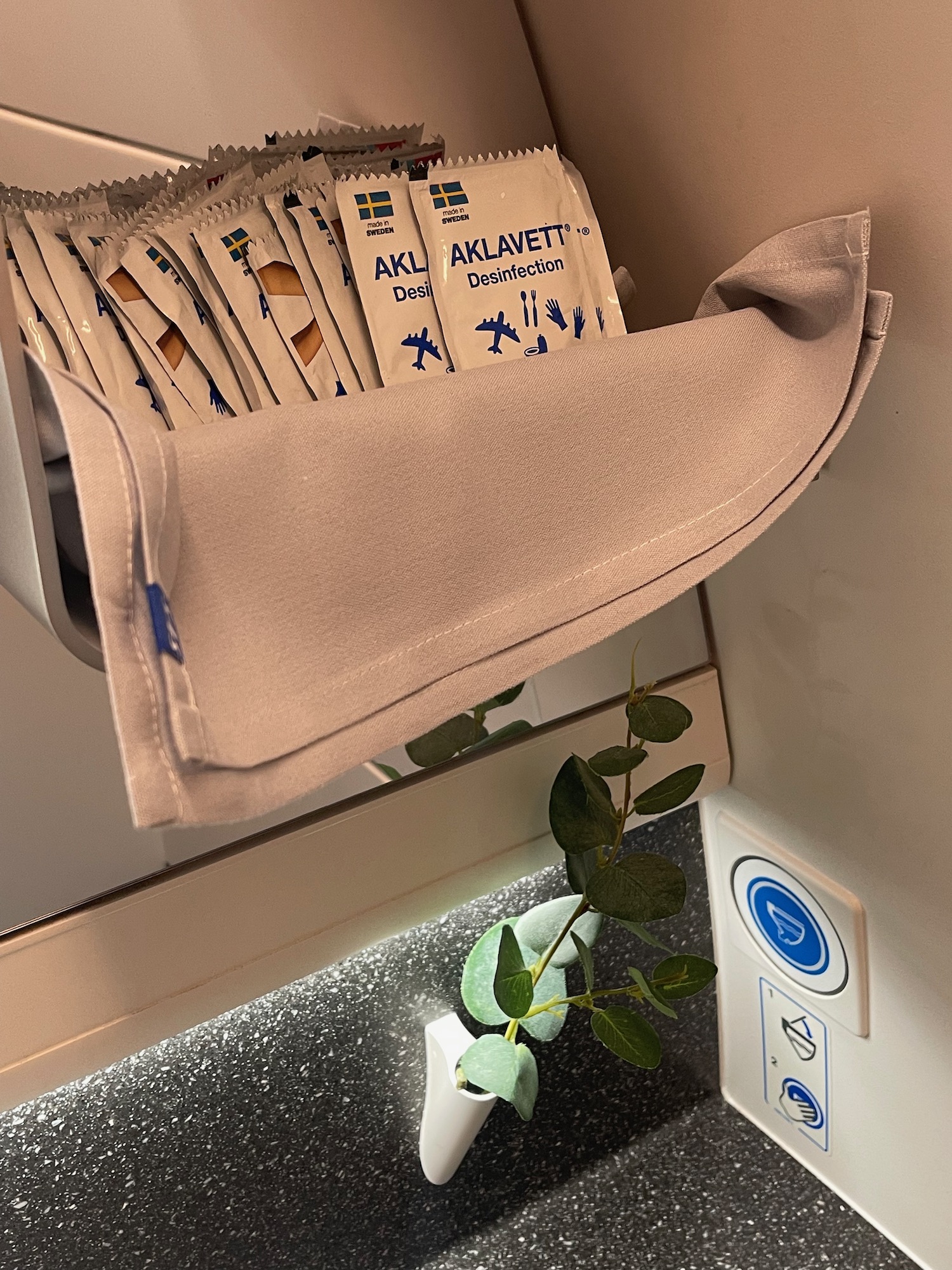 a towel in a shelf with packets