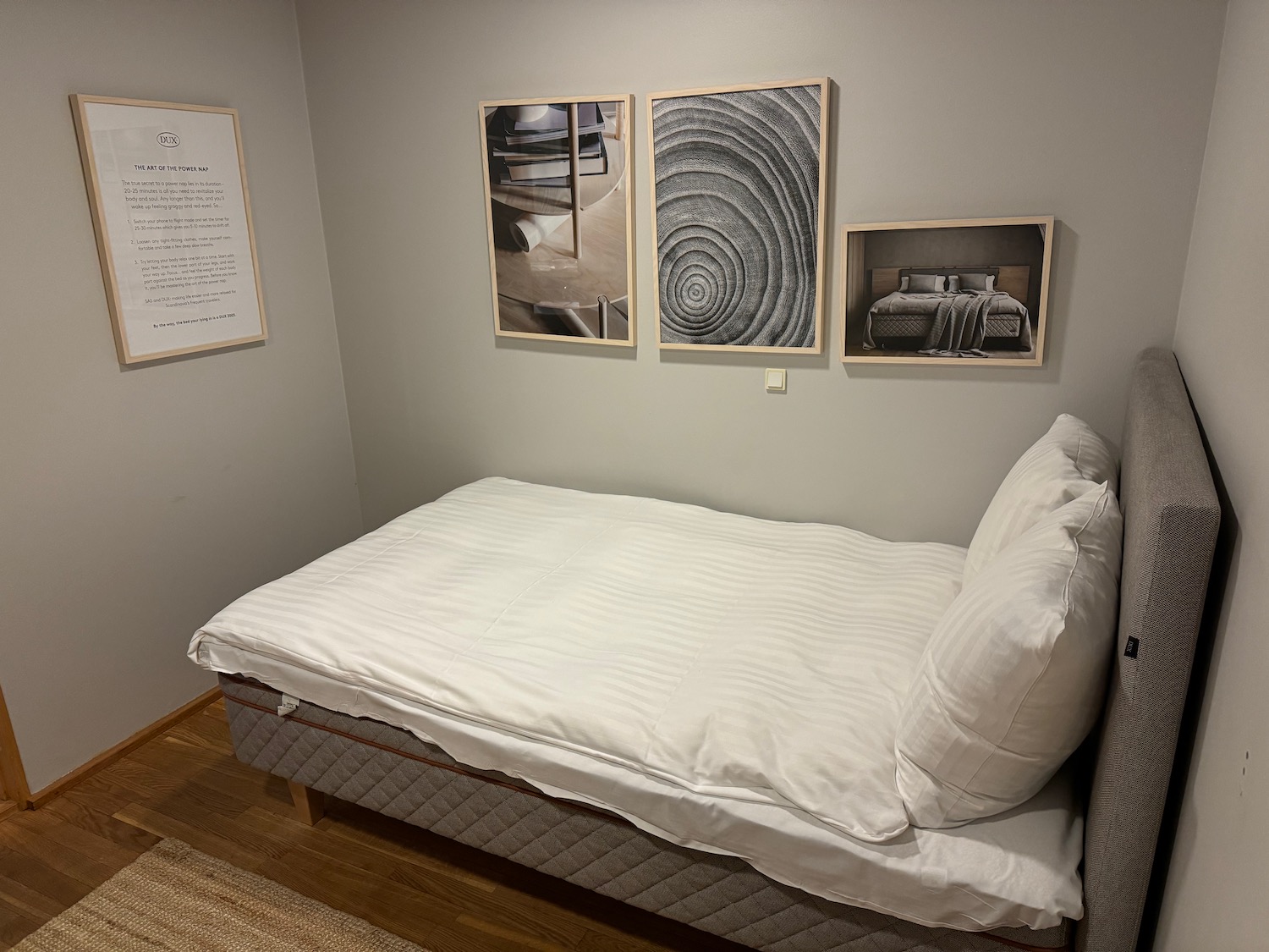 a bed with a white sheet and pillows
