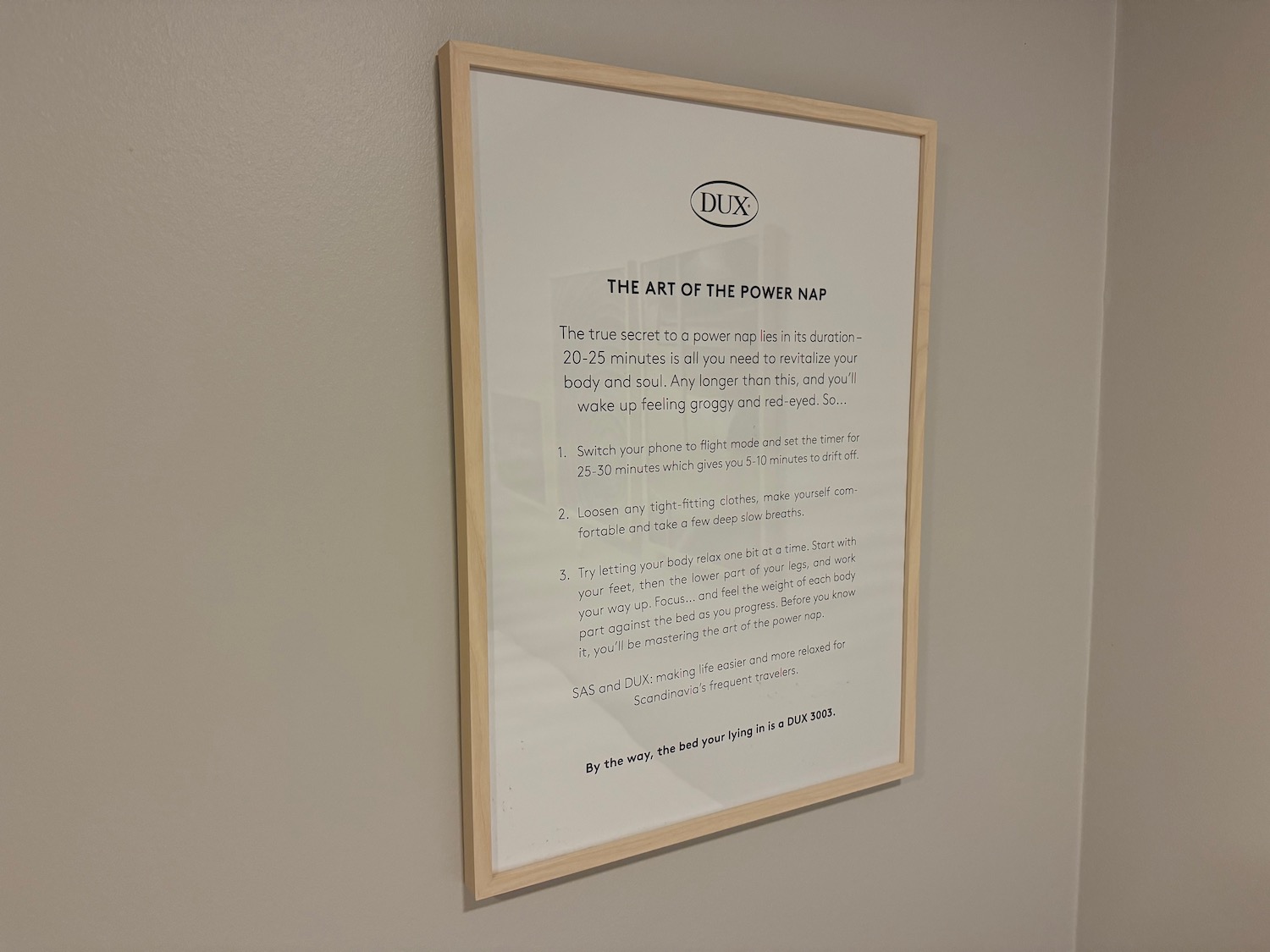 a white framed sign on a wall