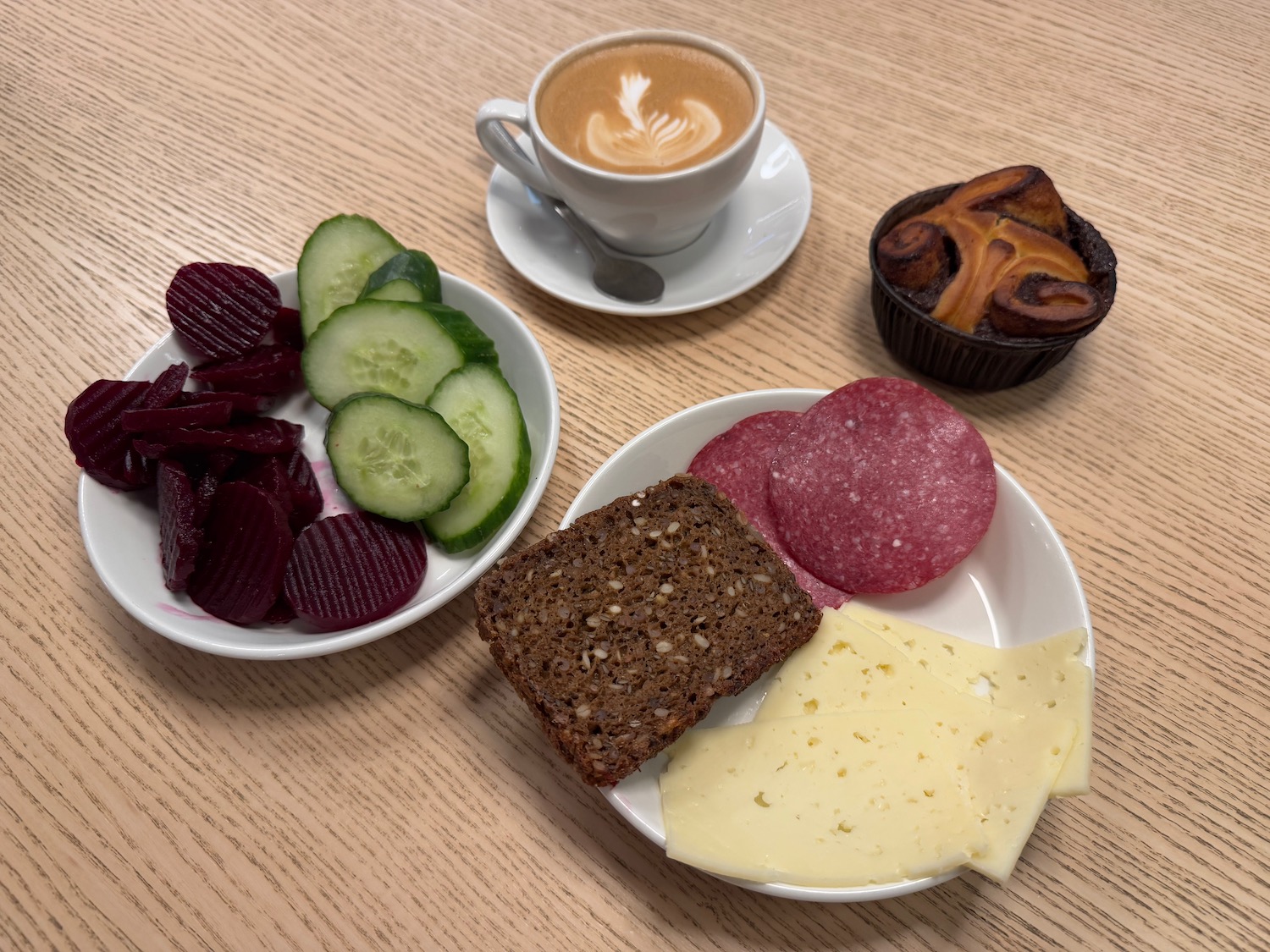 a plate of food and a cup of coffee