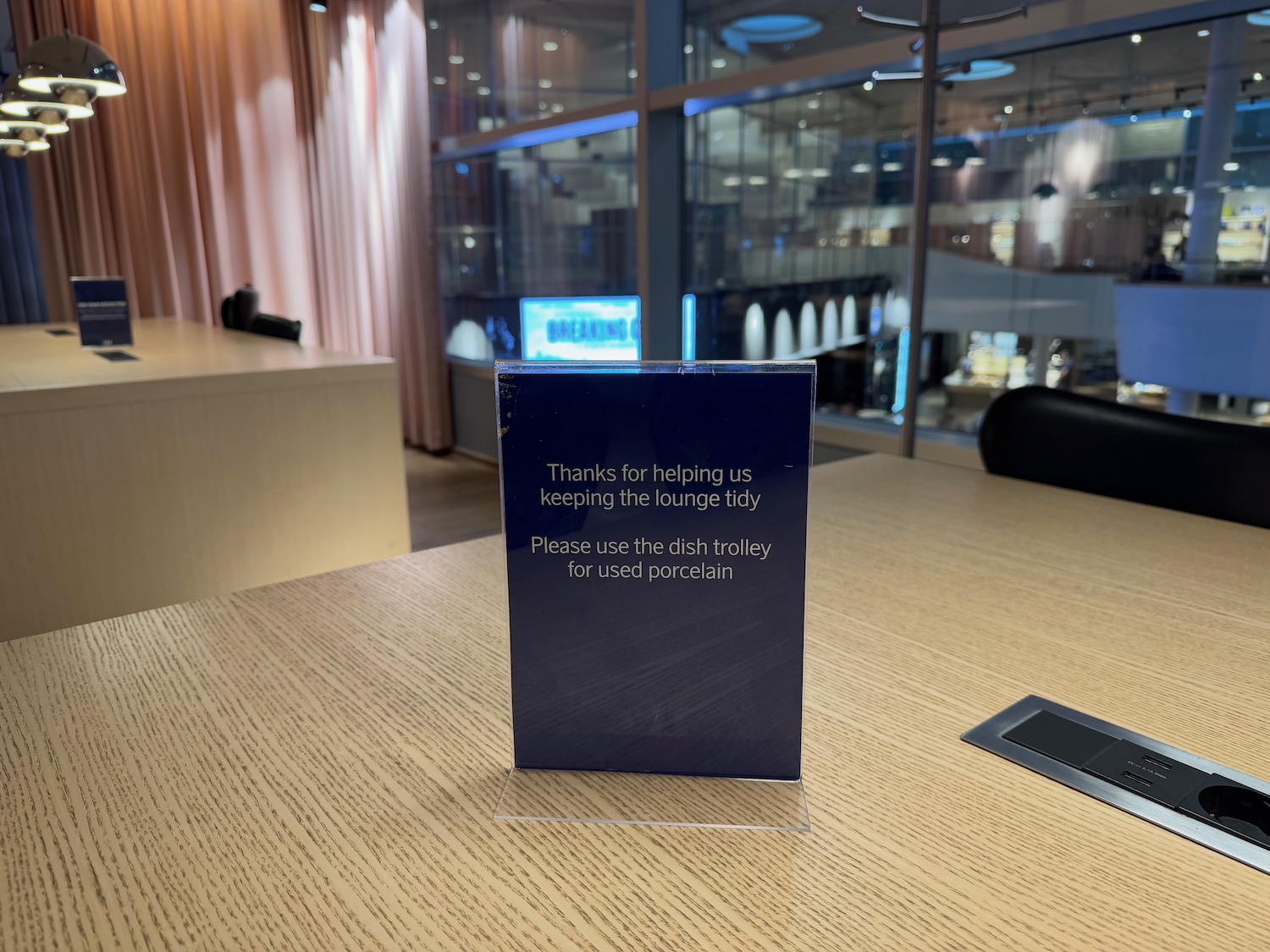 a blue rectangular sign on a table