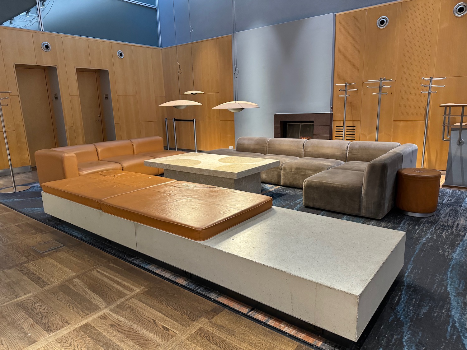 a room with a couch and a fireplace