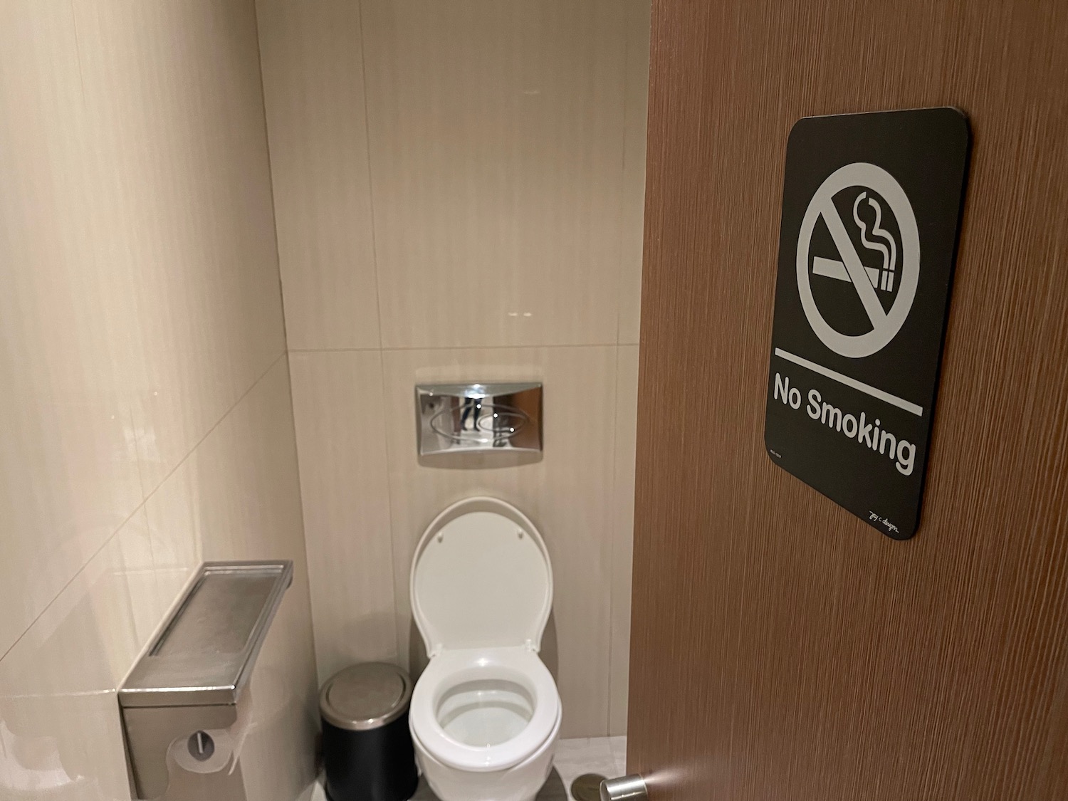 a no smoking sign in a bathroom