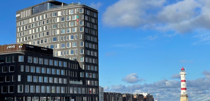 a building next to a body of water