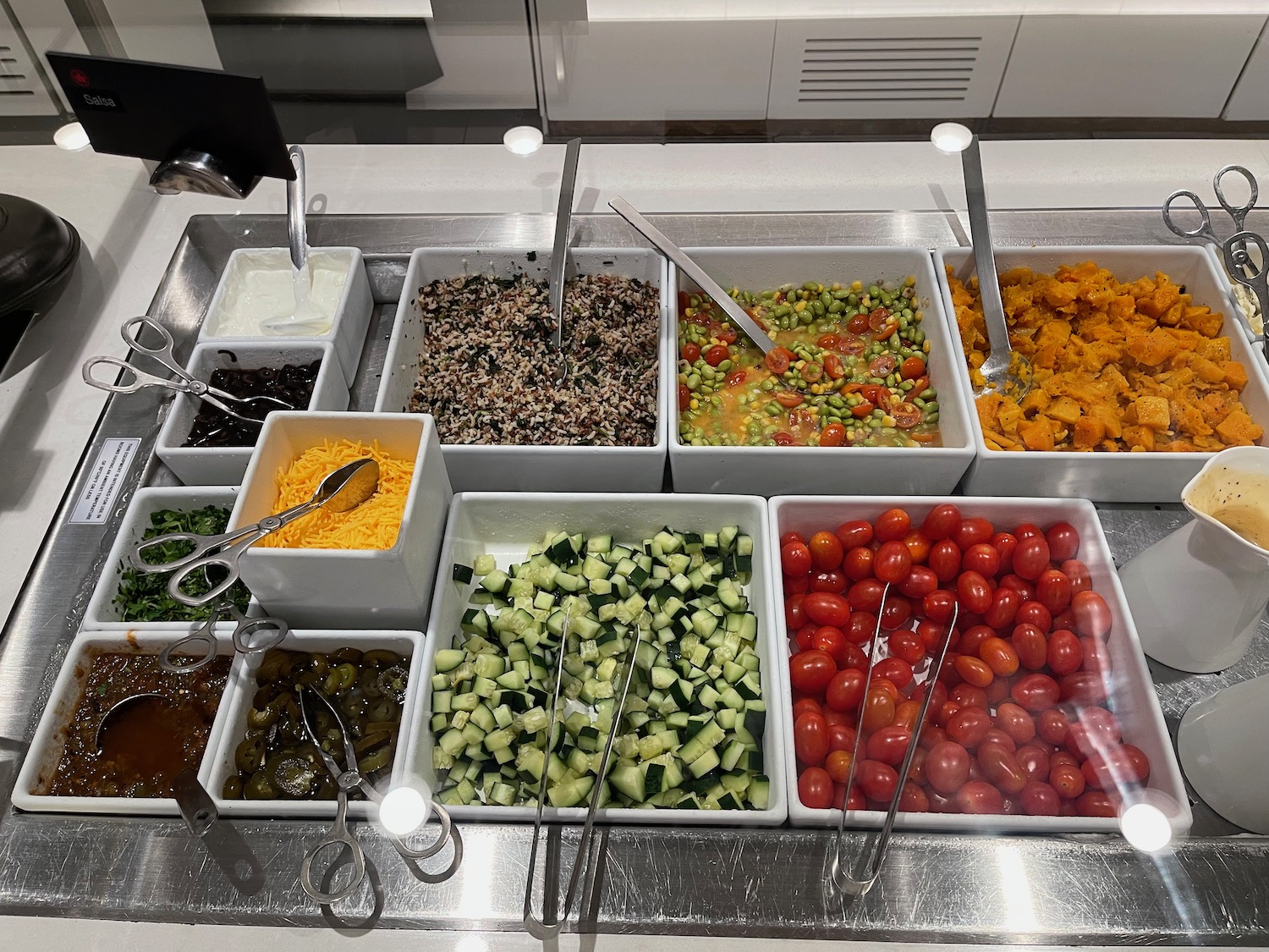 a salad bar with different types of food