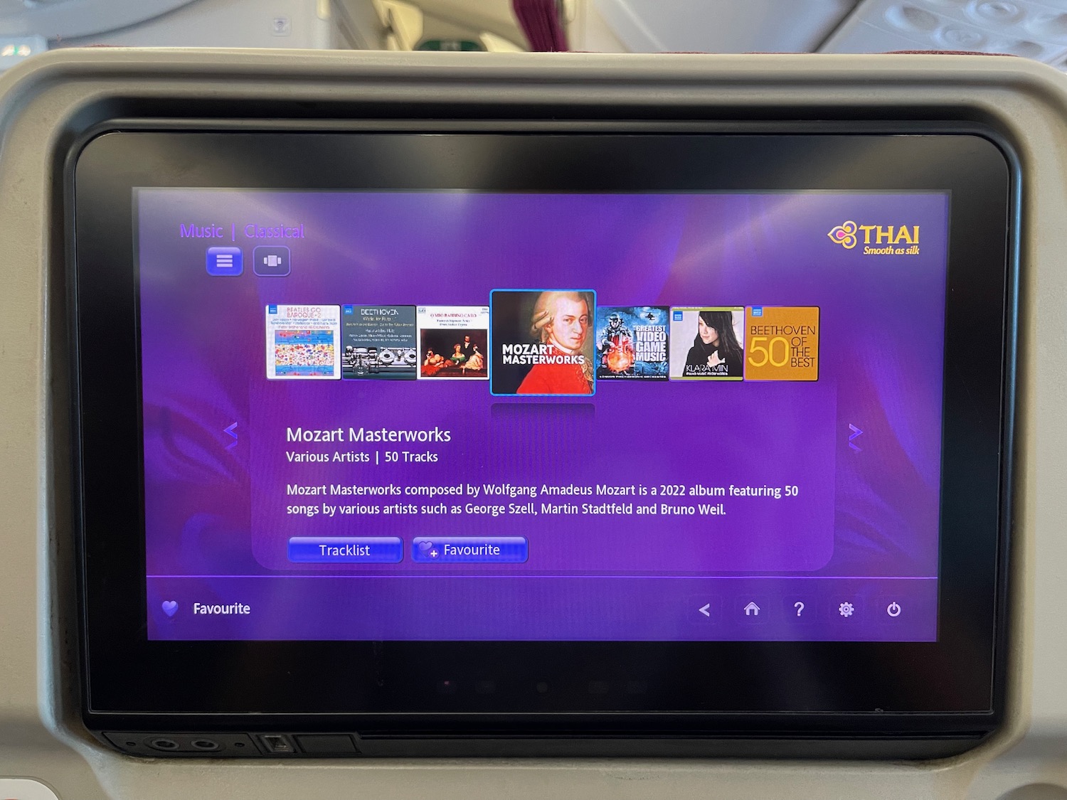 a black rectangular device with a purple screen