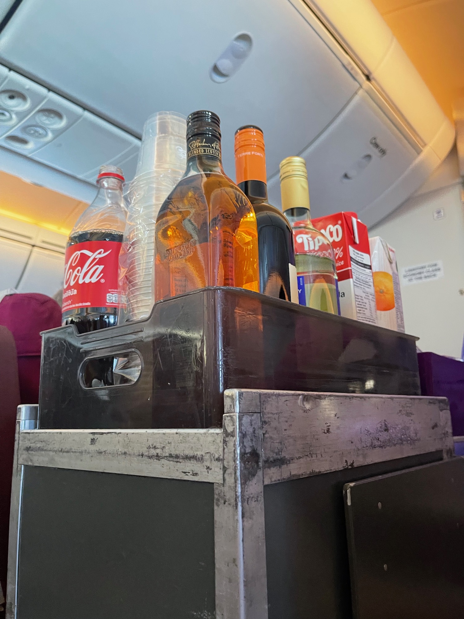 a group of bottles of alcohol in a crate