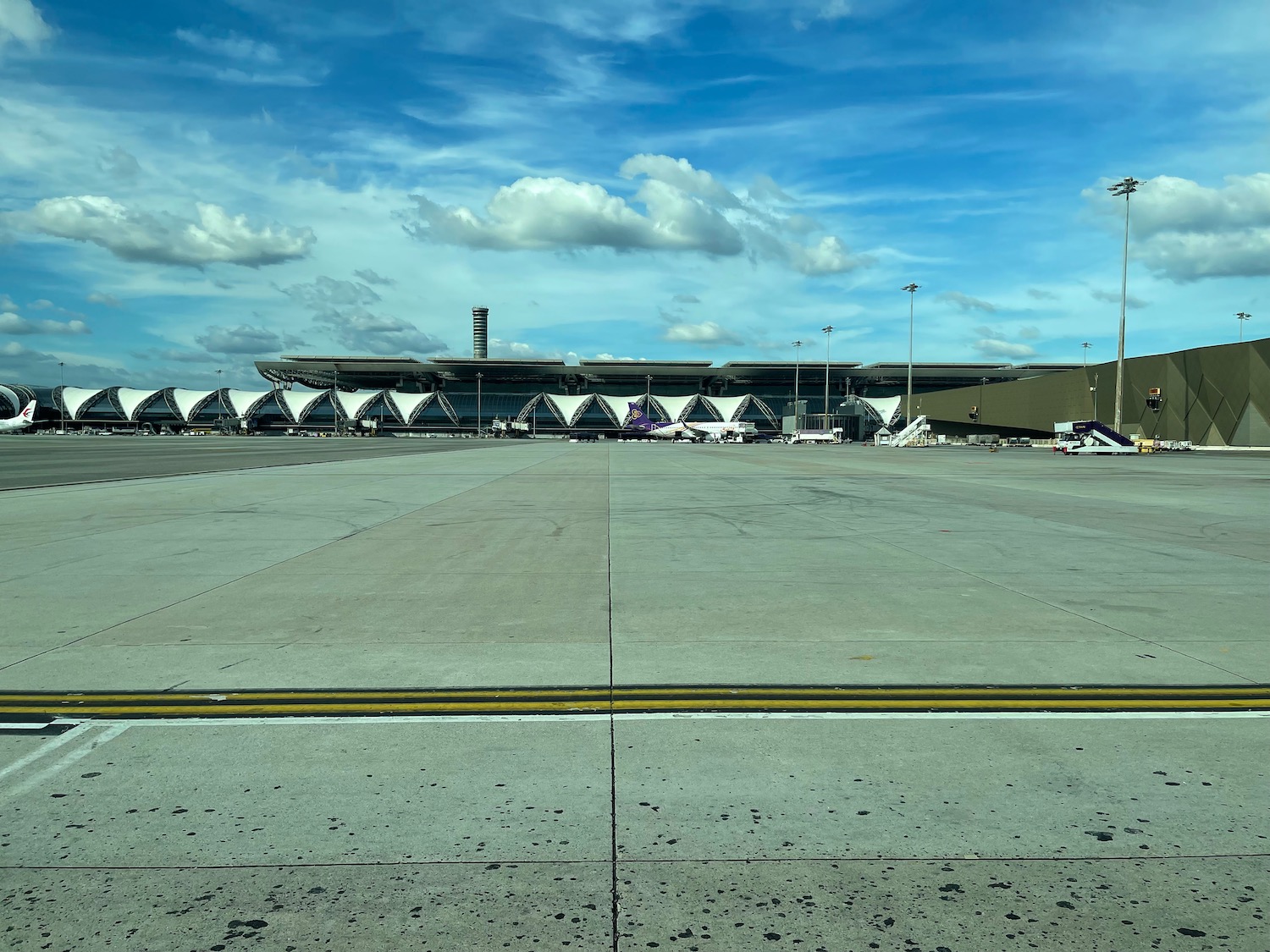 a runway with a building and a large building