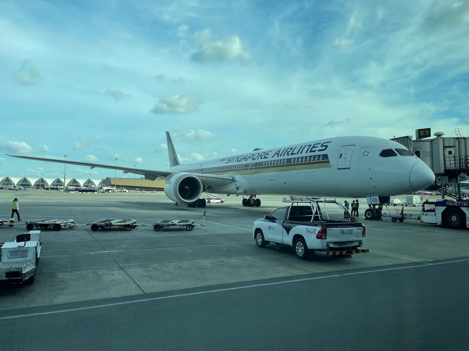 a white airplane parked on a tarmac