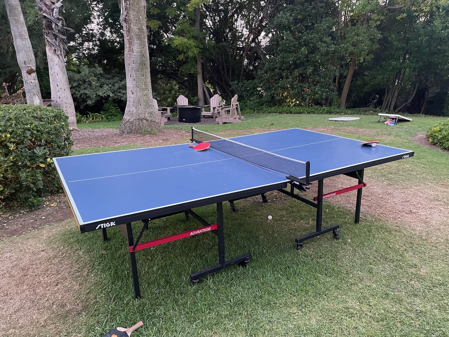 a ping pong table in a park