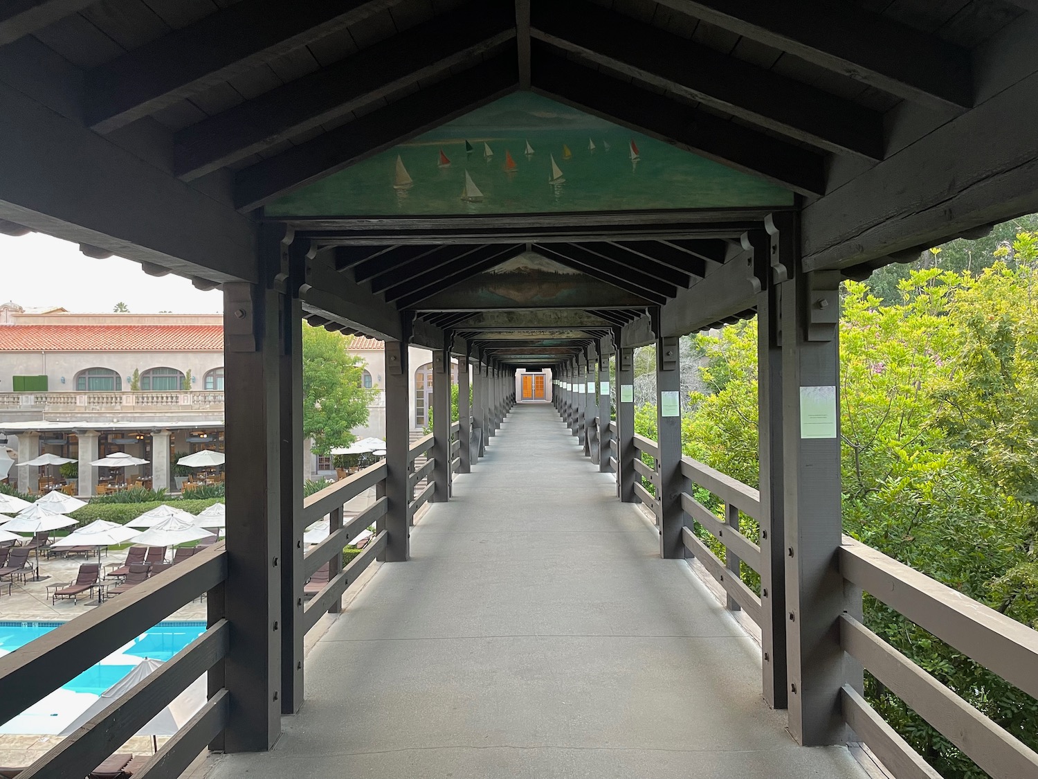 a walkway with a painted sign on it