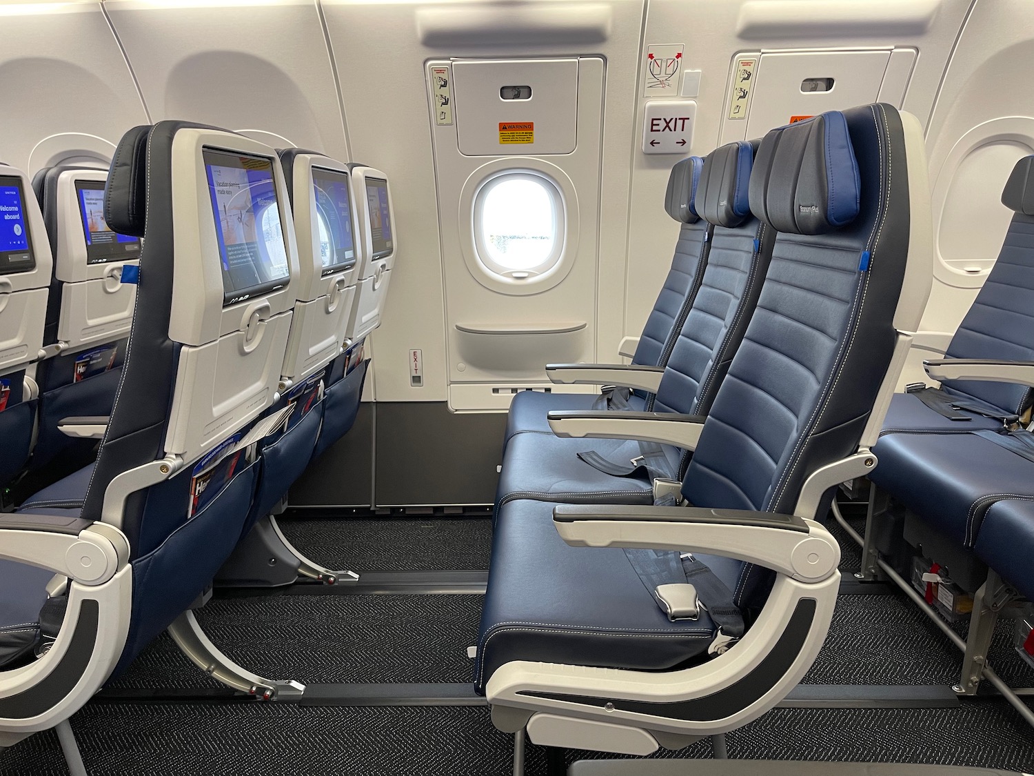 seats in an airplane with a window