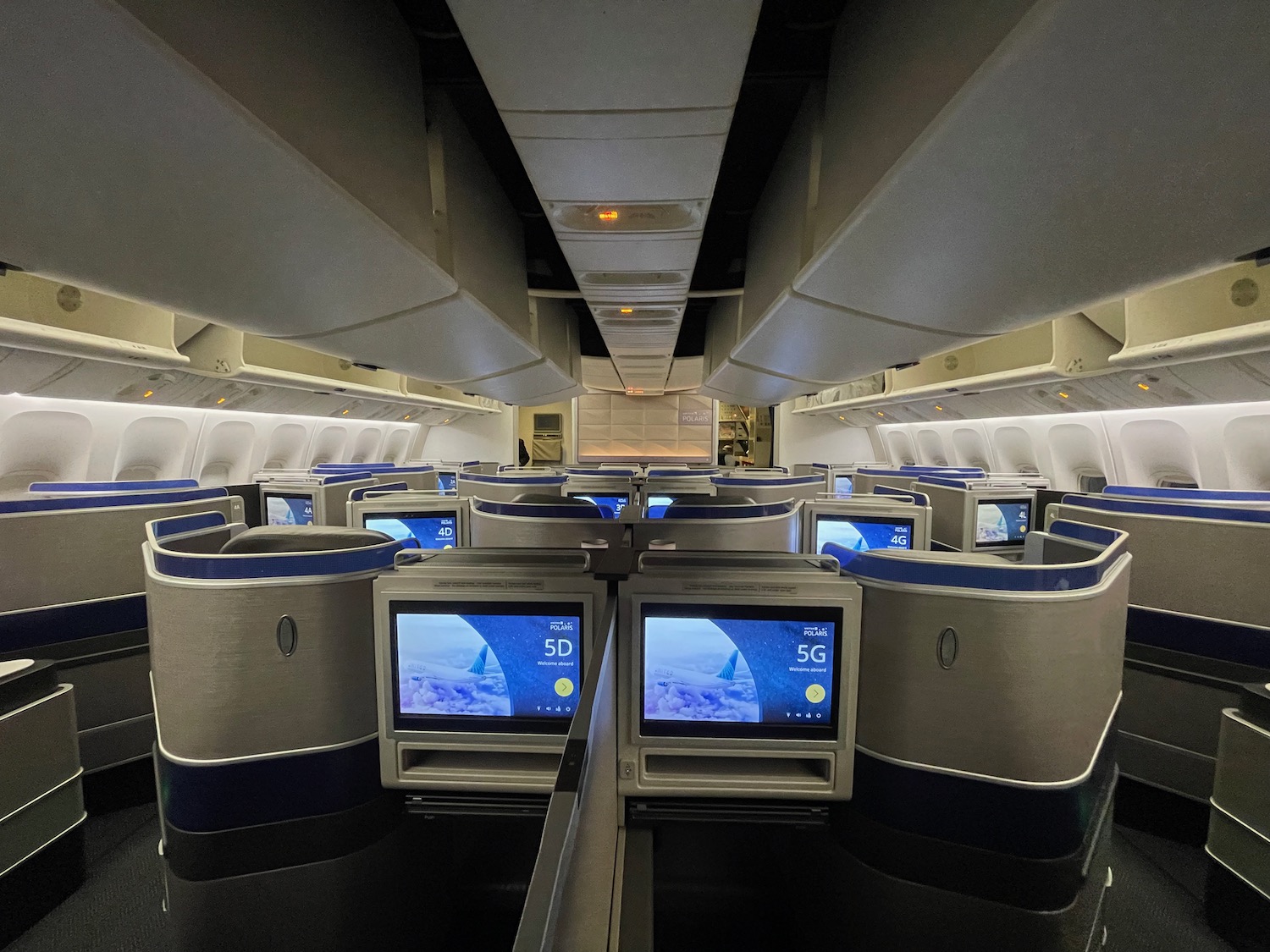 an airplane with a row of monitors