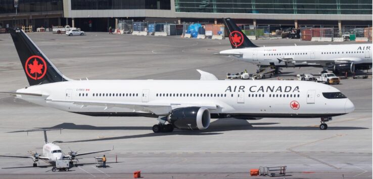 a group of airplanes on a runway