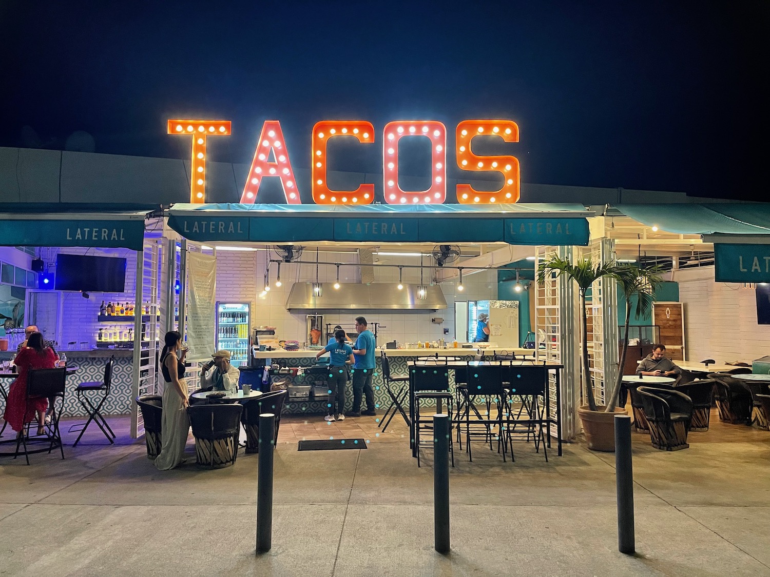a tacos restaurant with tables and chairs