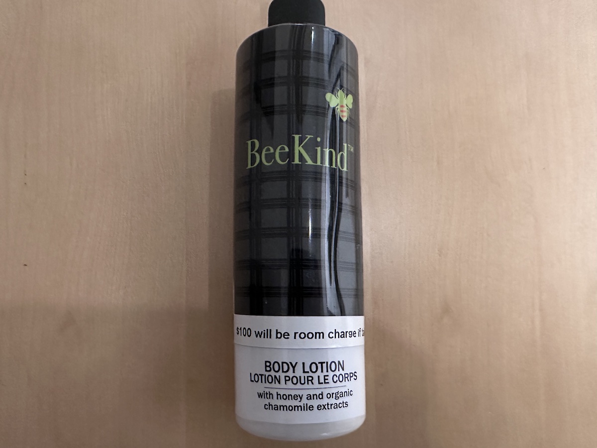 a black and white body lotion bottle