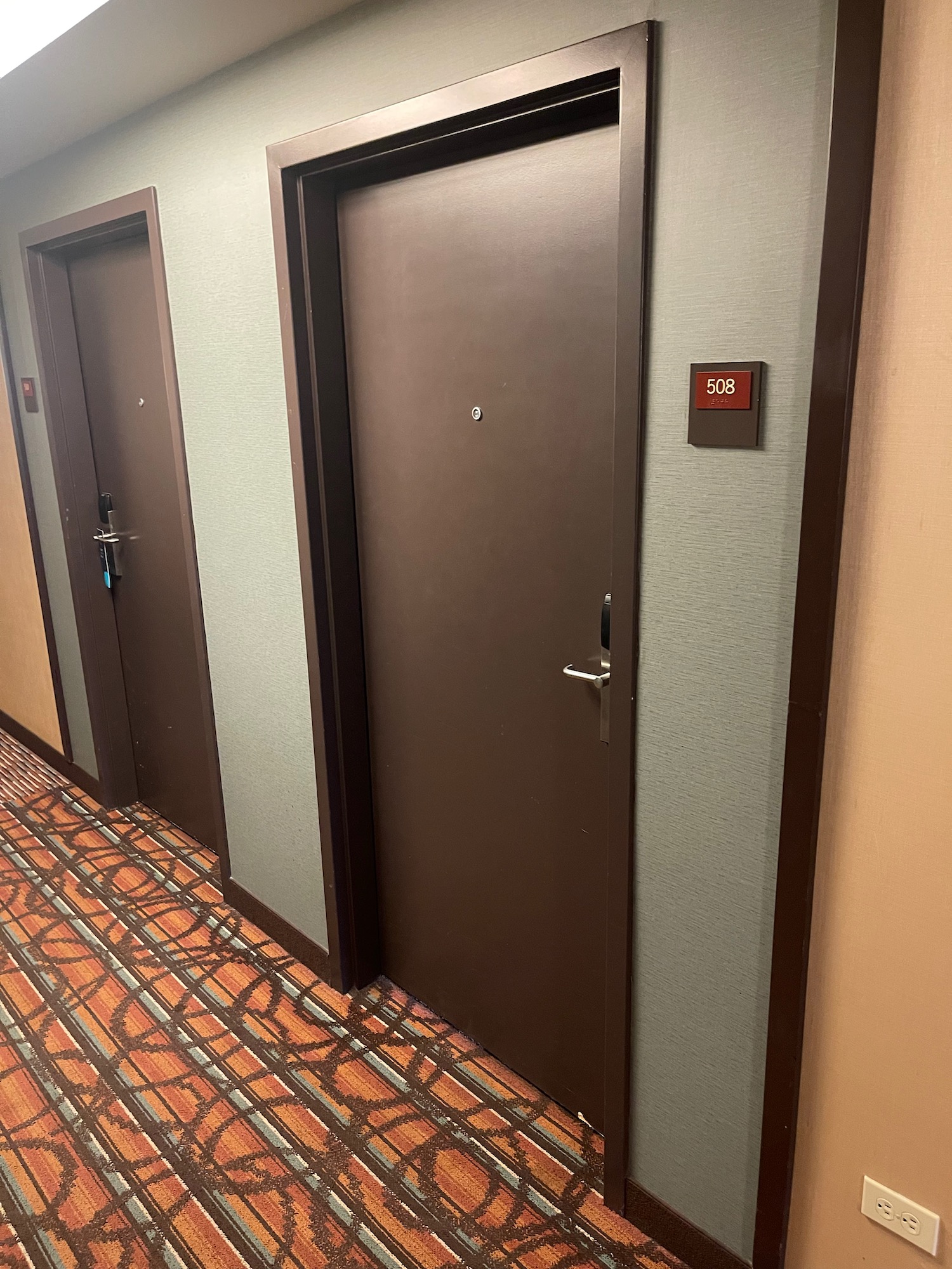 a row of doors in a hotel