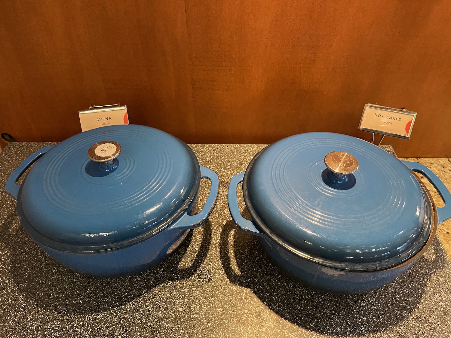 two blue pots on a counter