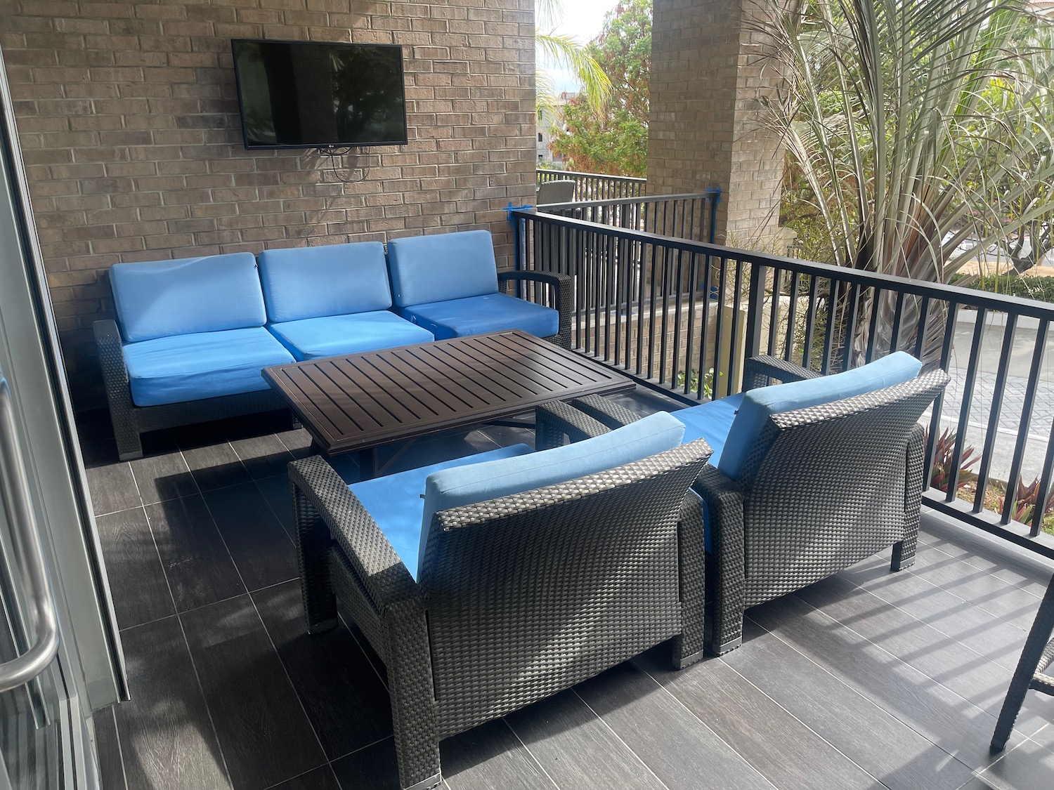 a patio with a table and chairs