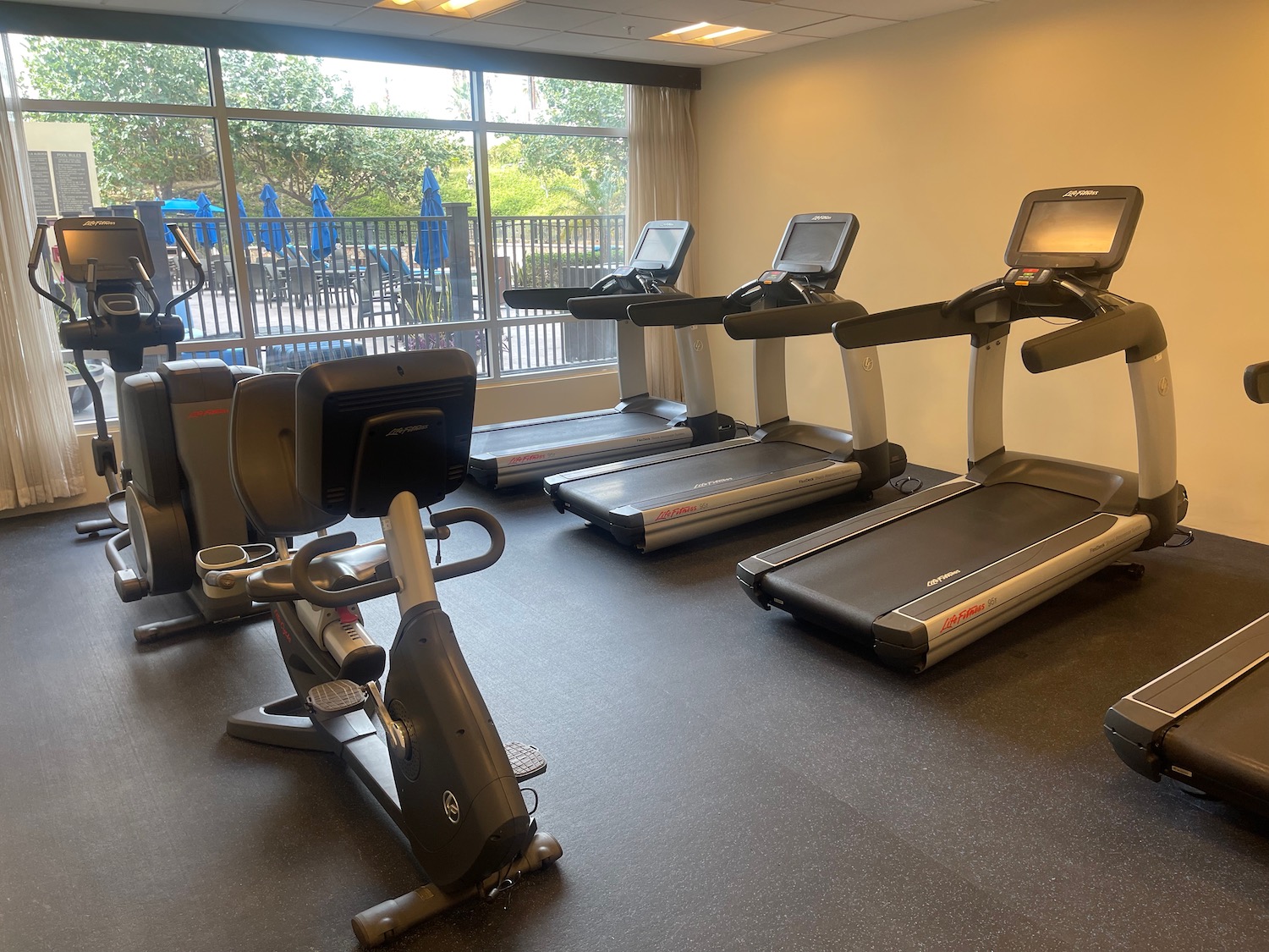 a room with treadmills and exercise machines