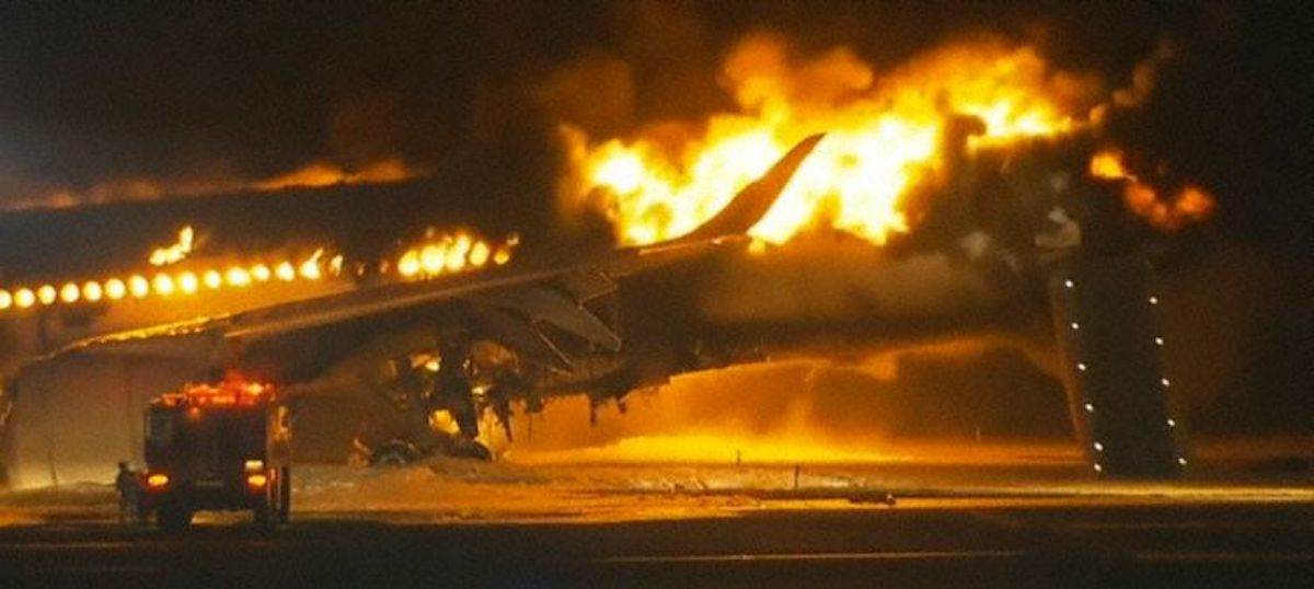 a plane on fire with smoke and flames