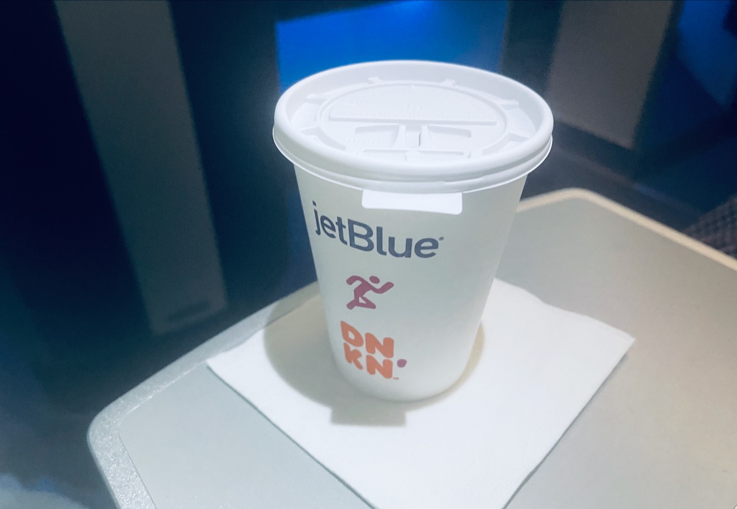 a white cup with a lid