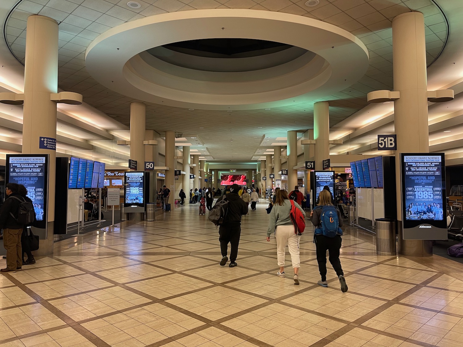 people walking in a large airport