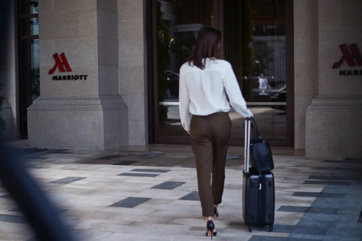 a woman walking with luggage