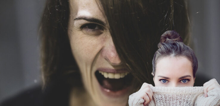 a woman with her mouth open and a sweater over her face