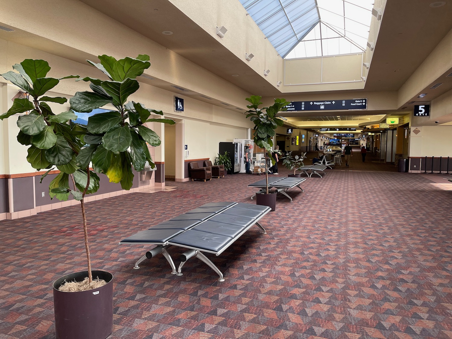 a group of benches in a large airport