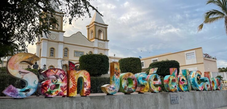 a large colorful sign outside of a building