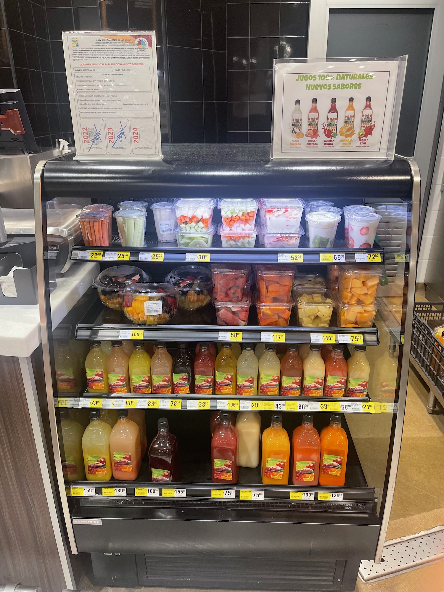 a display case of drinks and beverages
