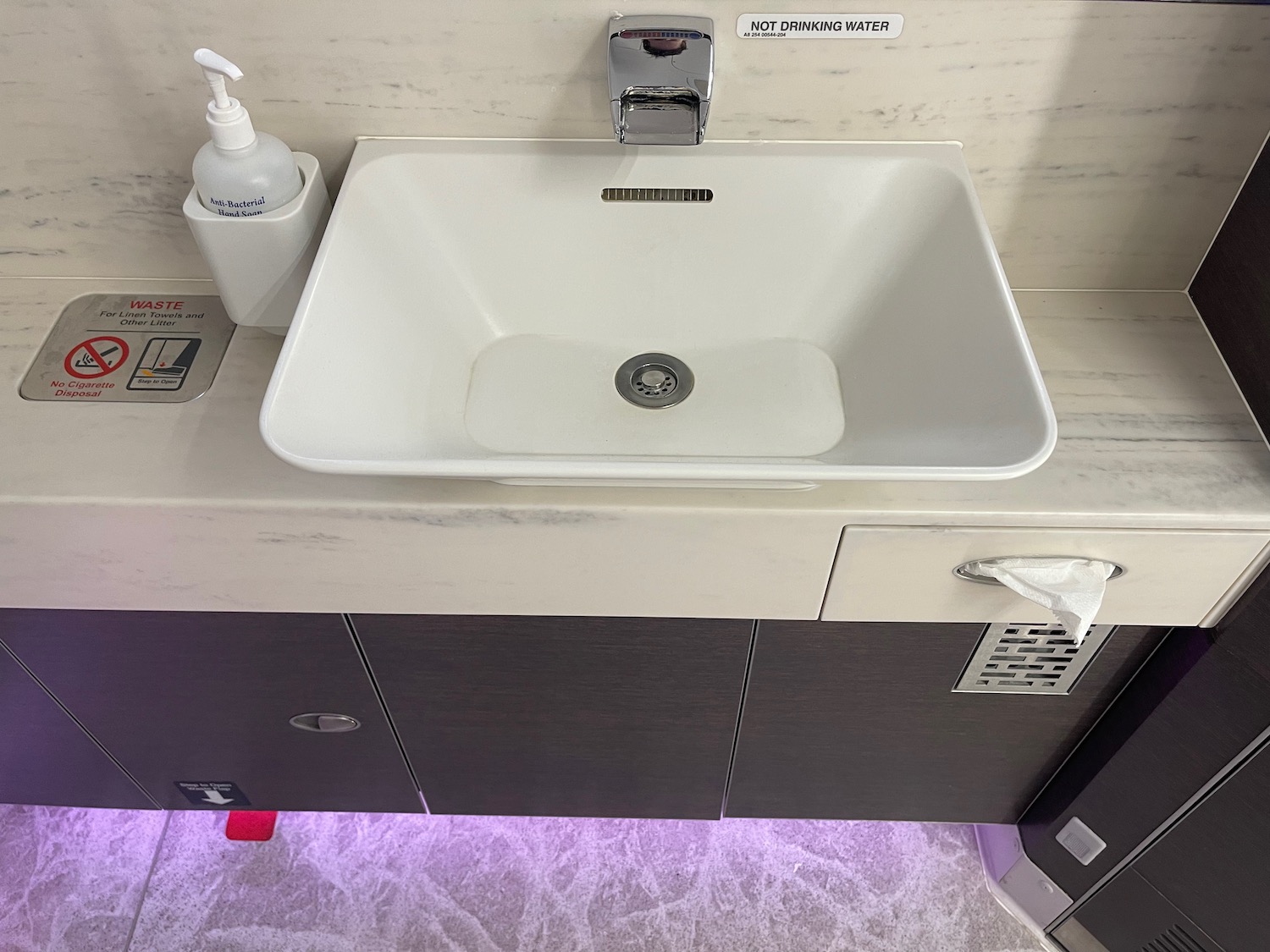 a sink with a soap dispenser