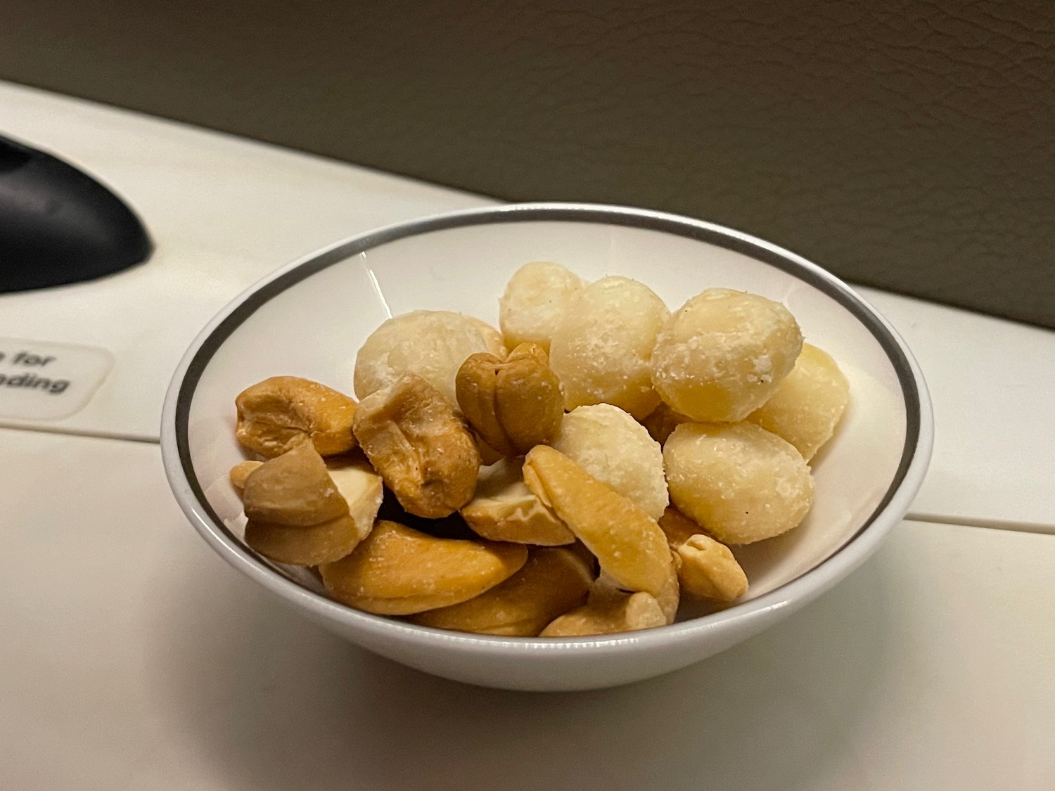 a bowl of nuts on a counter