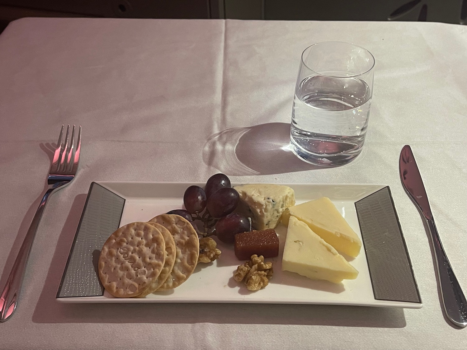 a plate of food and a glass of water