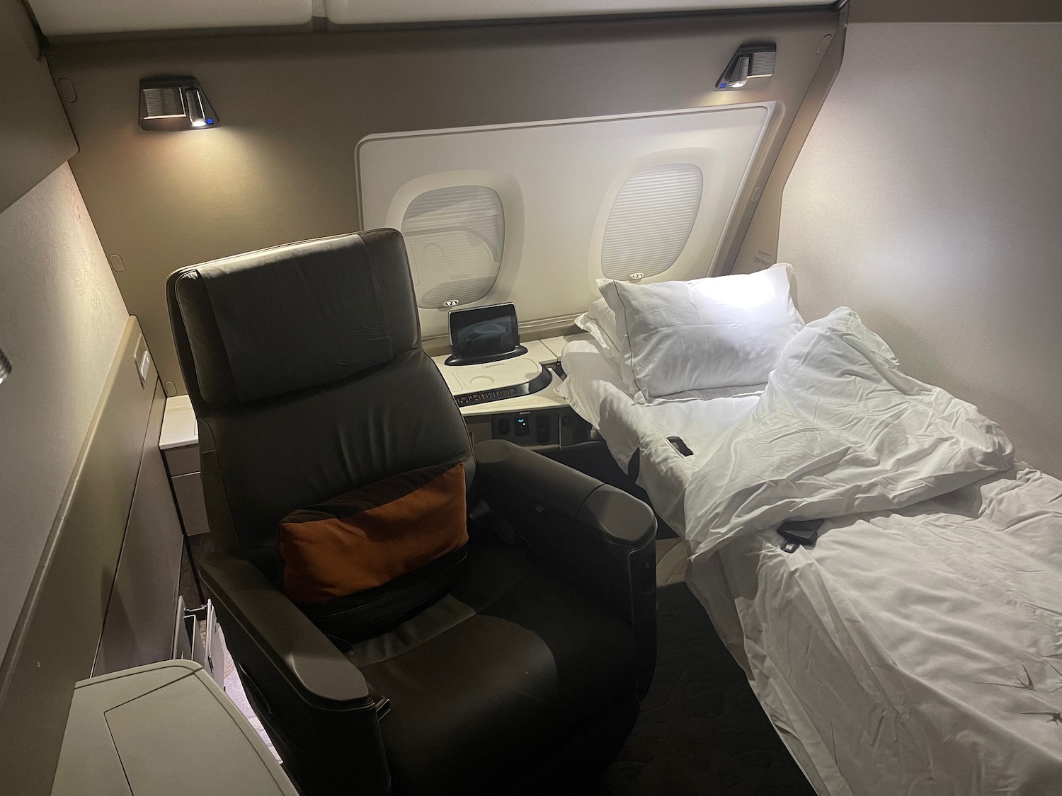 a chair and a bed in a plane