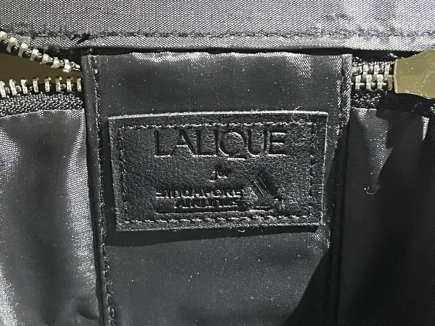 a black leather label on a black bag
