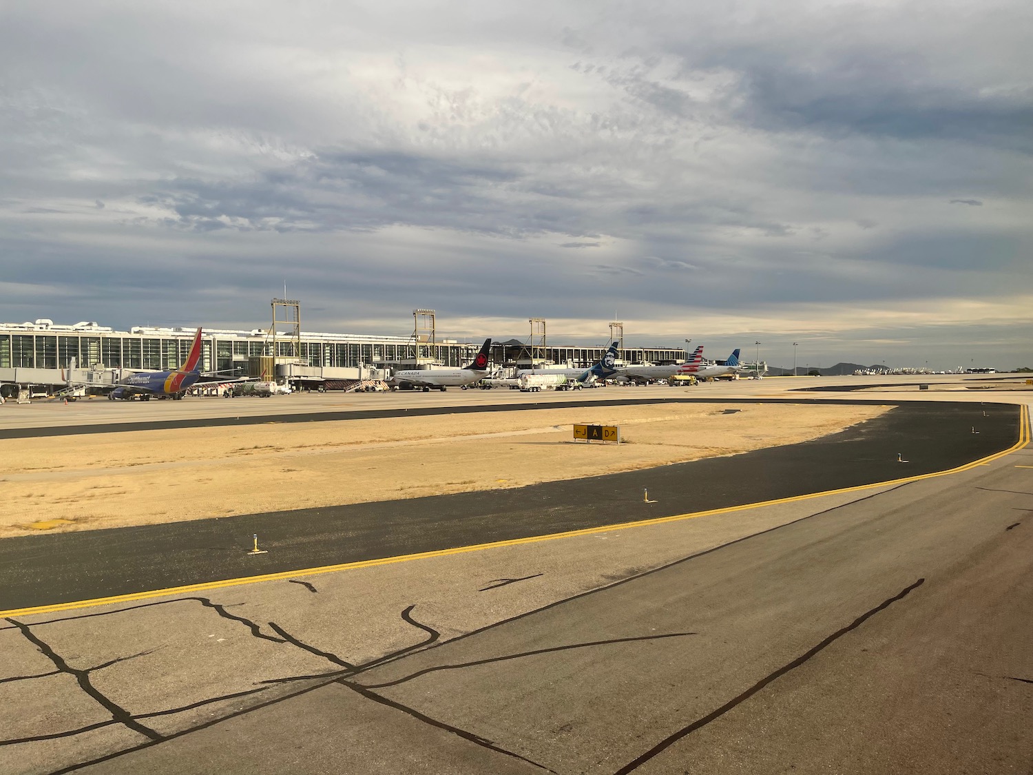 a runway with airplanes on it