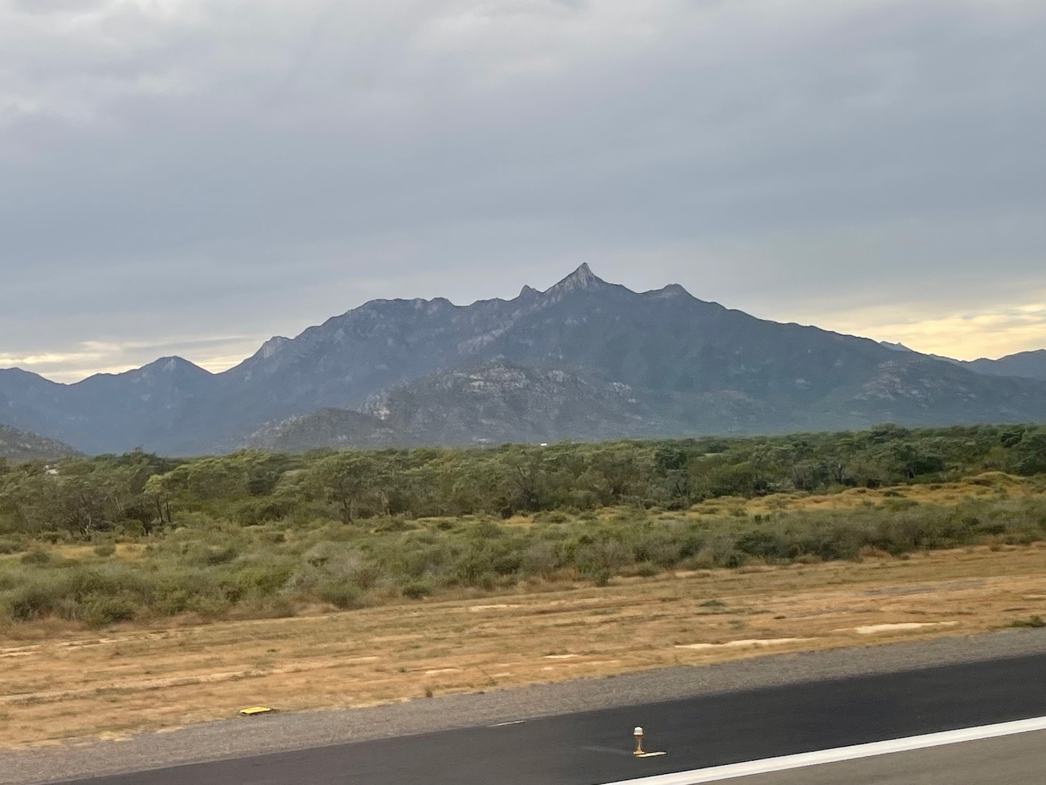 a road with a mountain in the background