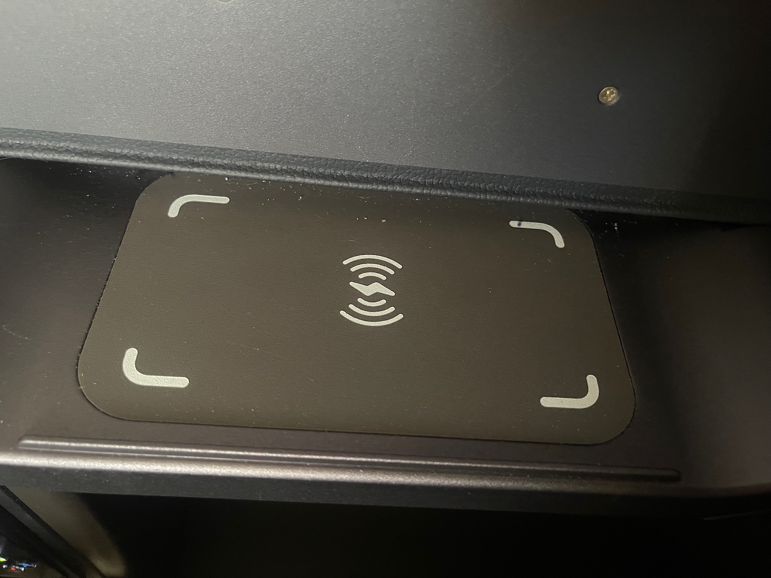 a wireless charging pad on a table