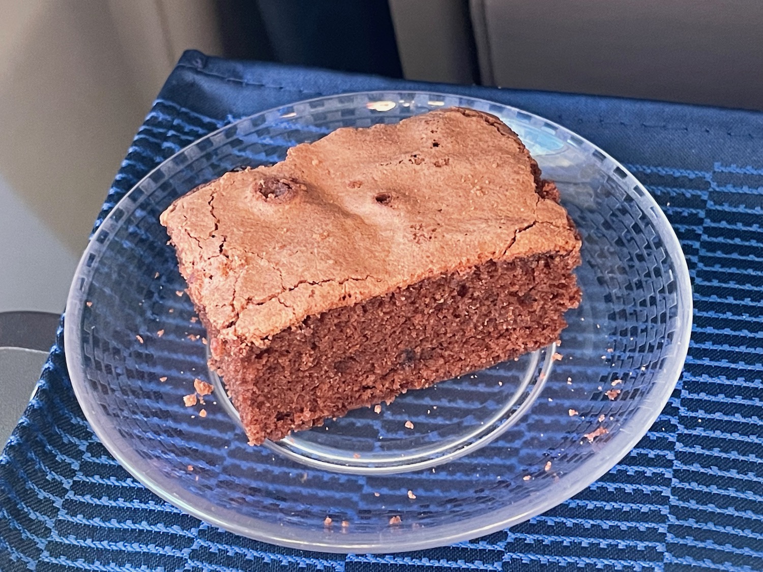 a brownie on a clear plate