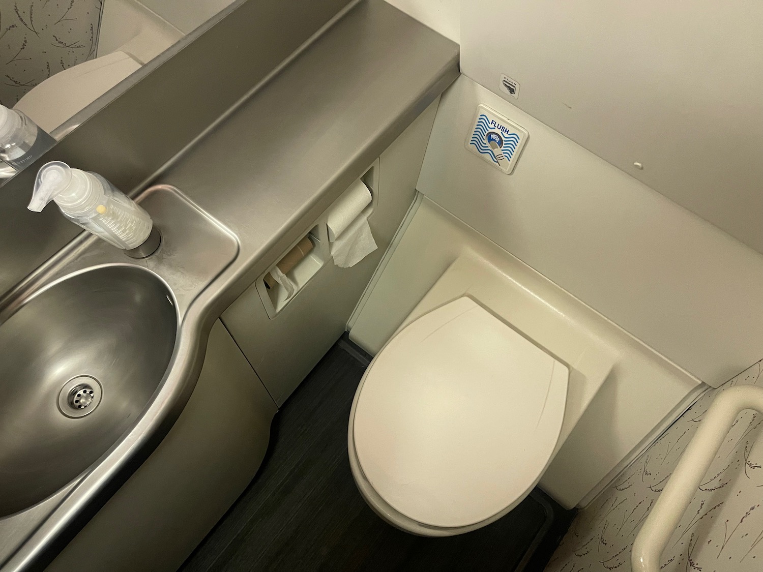 a toilet and sink in a bathroom