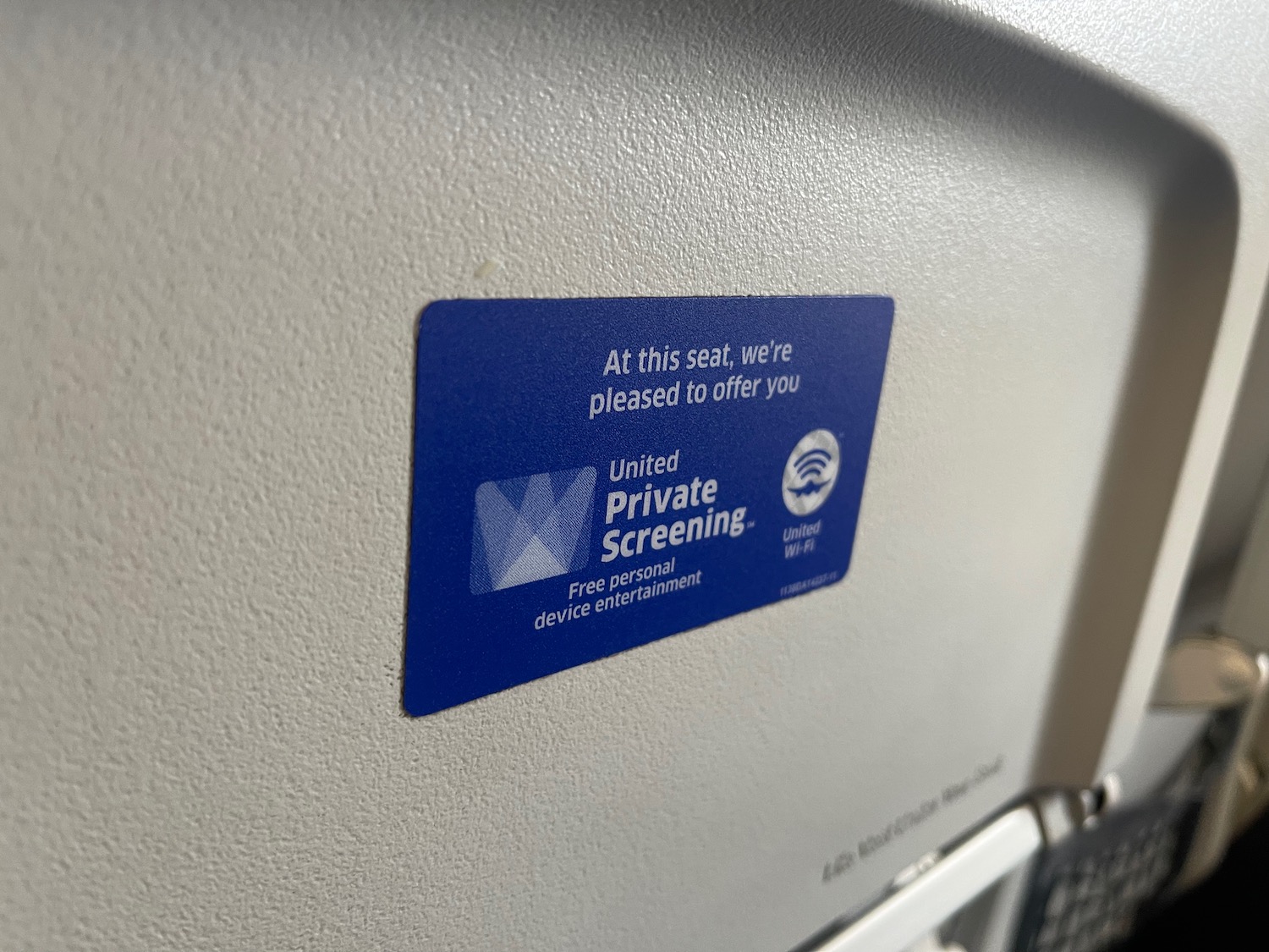 a blue and white sign on a plane