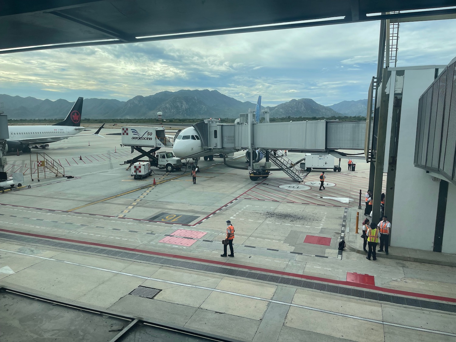 a group of people standing around an airplane