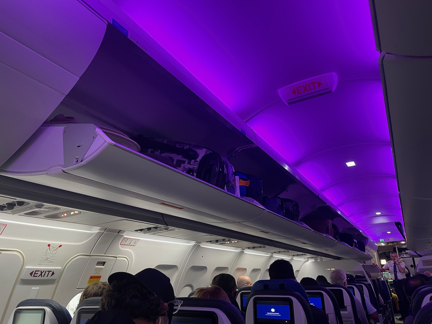 a group of people sitting on an airplane