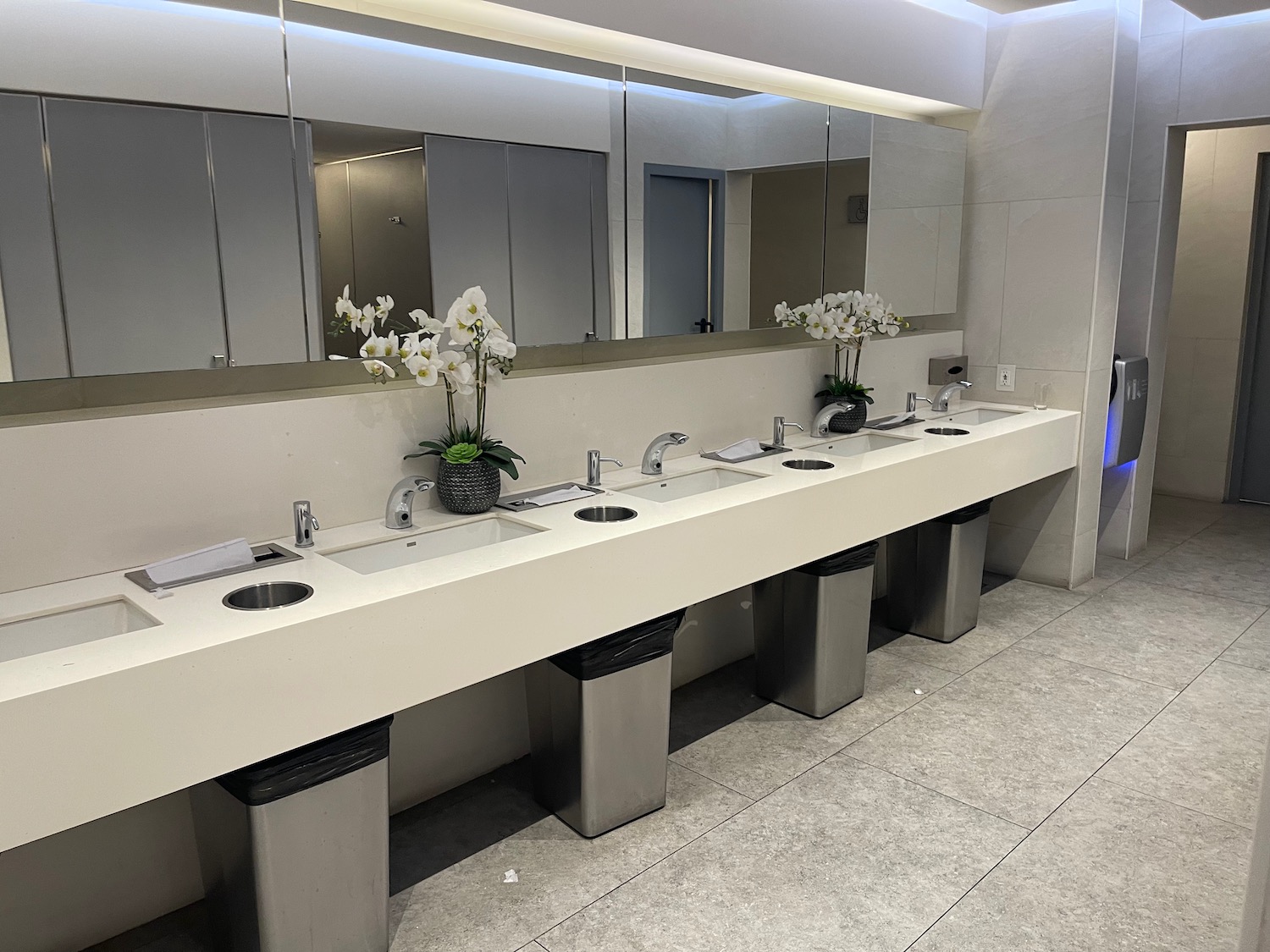 a bathroom with sinks and mirrors