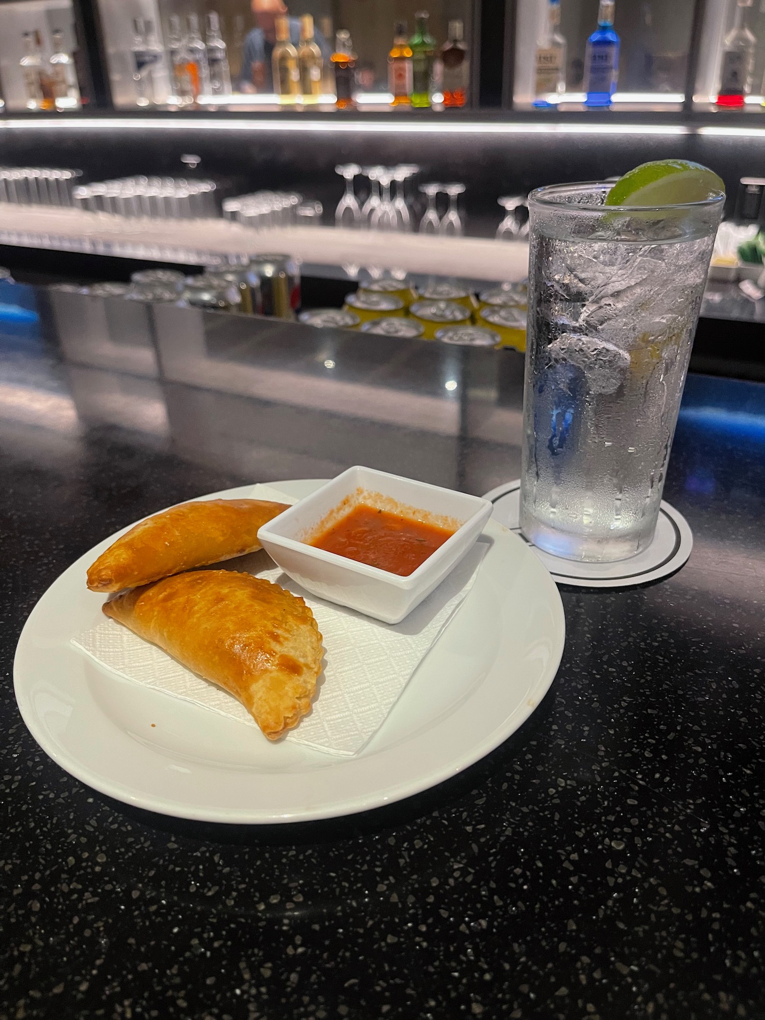 a plate of food and a glass of water