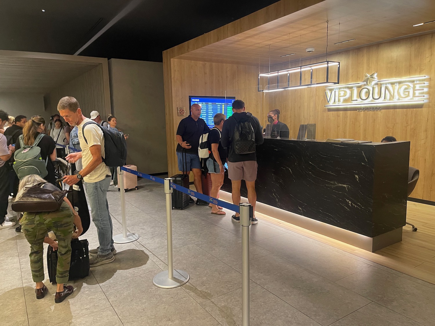 people standing in front of a reception desk