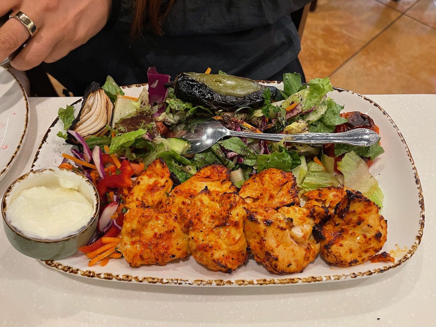 a plate of food with a fork and a spoon